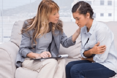 Dentist explaining to patient about Alternative Gum treatments